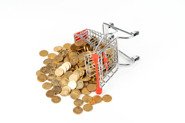 gold coins falling from a collapsed shopping cart
